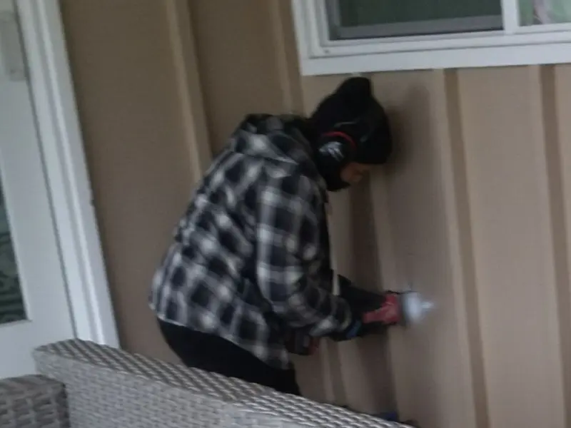 Professional electrician installing an exterior outlet in Nottawa